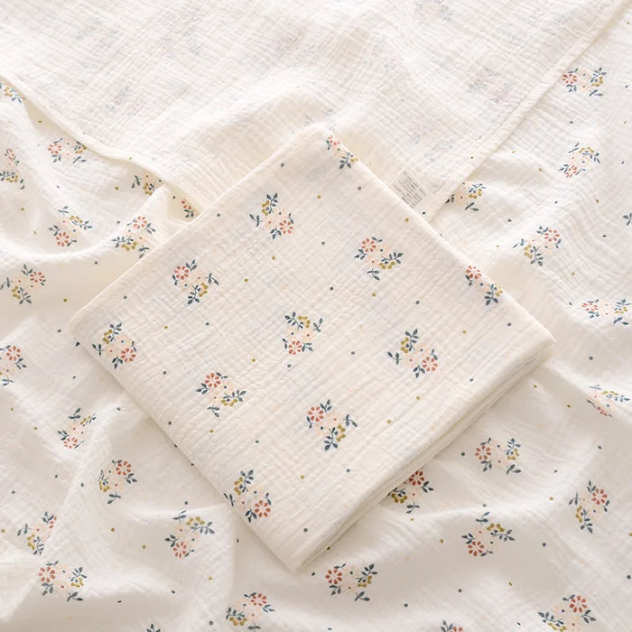 Muslin swaddle blanket with retro flower print