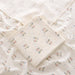 Muslin swaddle blanket with retro flower print