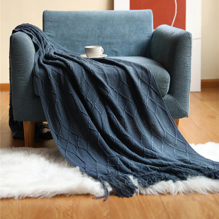 Navy cable knit throw on an armchair