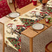 Vintage Santa and reindeer Christmas table runner on a wooden dining table