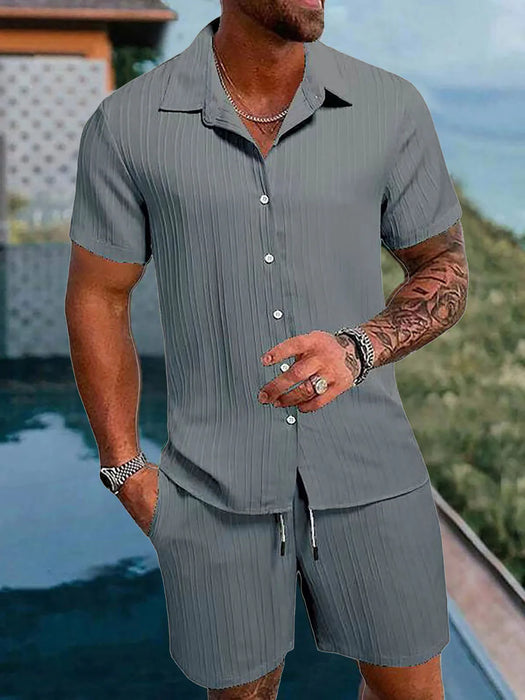 Man in a grey short sleeve shirt and shorts set
