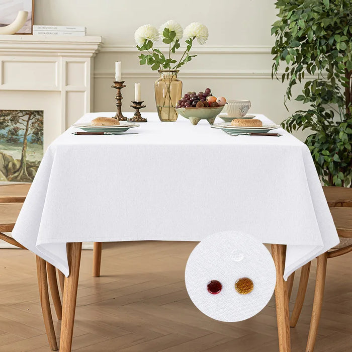 White tablecloth on a dining table with flowers