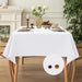 White tablecloth on a dining table with flowers