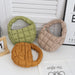 Olive, beige and caramel mini puffer totes on a table