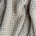 Close-up of the khaki net knit texture