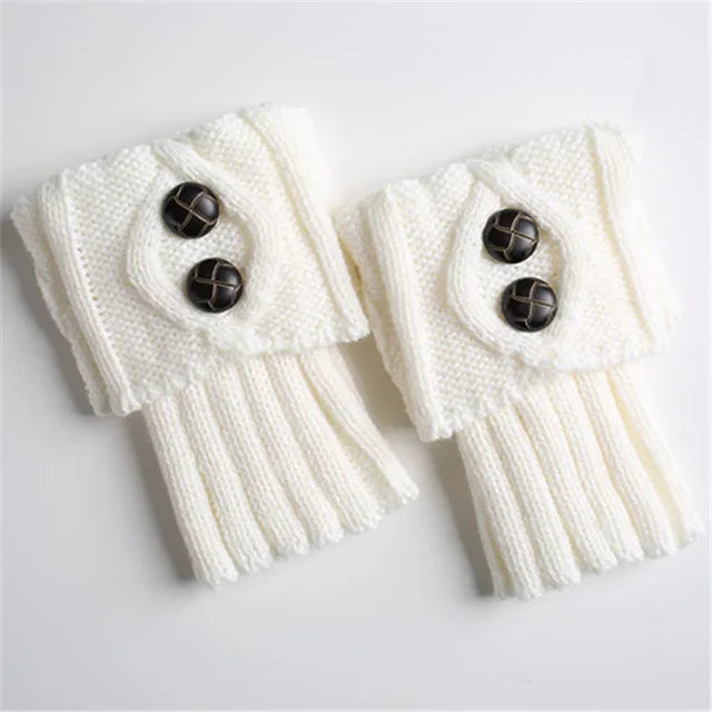 Pair of white knit leg warmers with two buttons