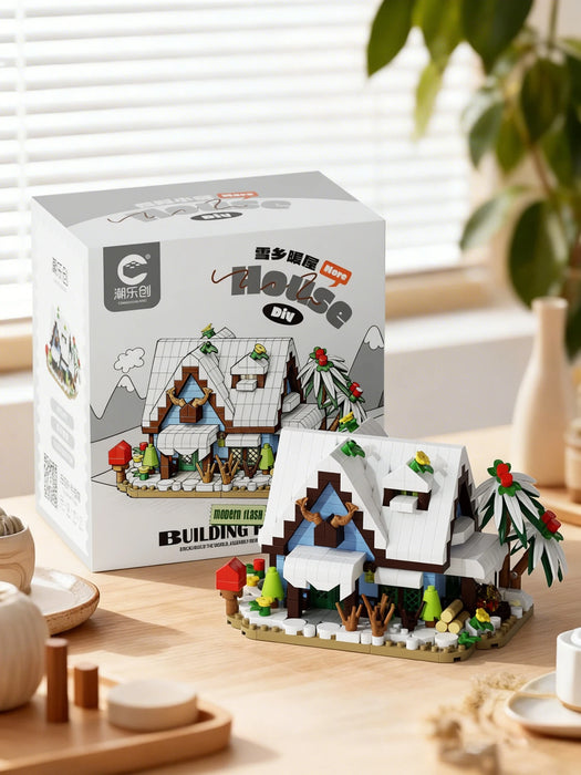 Snowy cabin set in front of its box