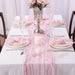 Pink purple gauze runner on a set dinner table