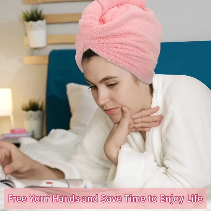 Woman reading with her hair wrapped in a pink hair towel