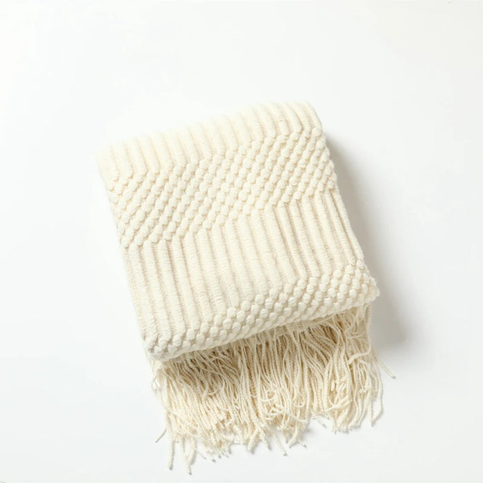 Folded cream bubble knit throw