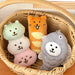 Three food plush charms in a wicker basket
