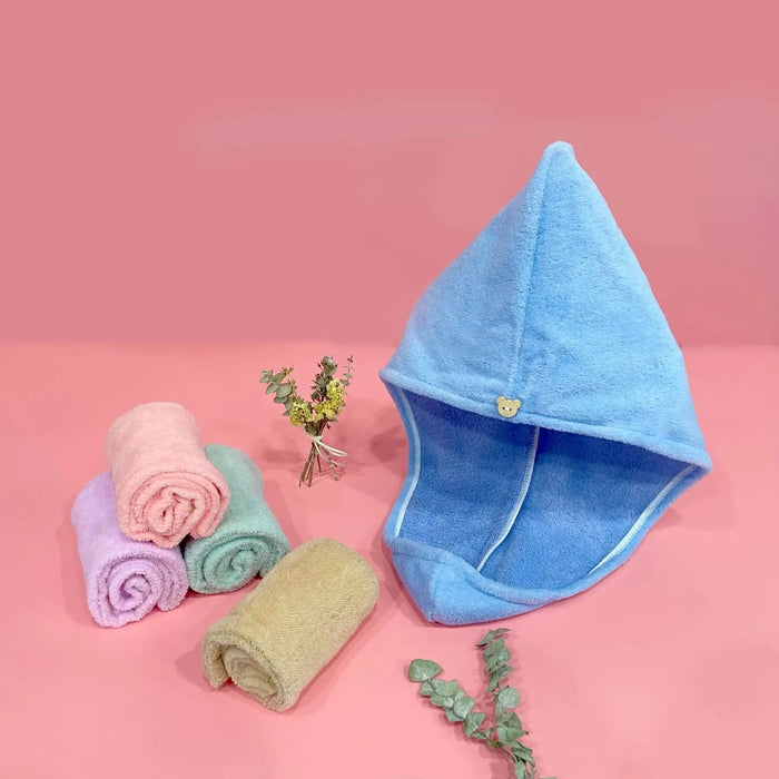 Blue hair towel wrap beside rolled towels