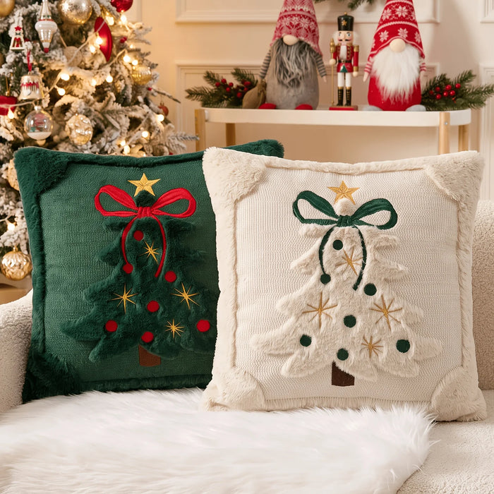 Green and beige Christmas tree cushion pair on a sofa