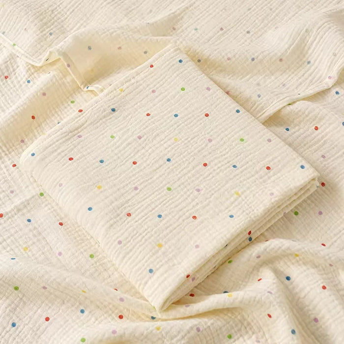 Muslin swaddle blanket with colourful dot print
