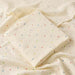 Muslin swaddle blanket with colourful dot print