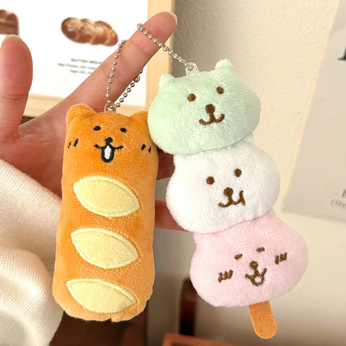 Bread bear and dango puppy charms held up by their chains