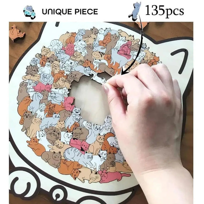 Hands fitting pieces into a cat-shaped wooden puzzle, 135 pieces