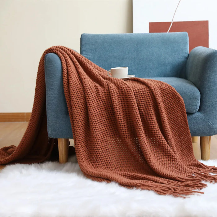 Caramel net knit throw on a blue armchair